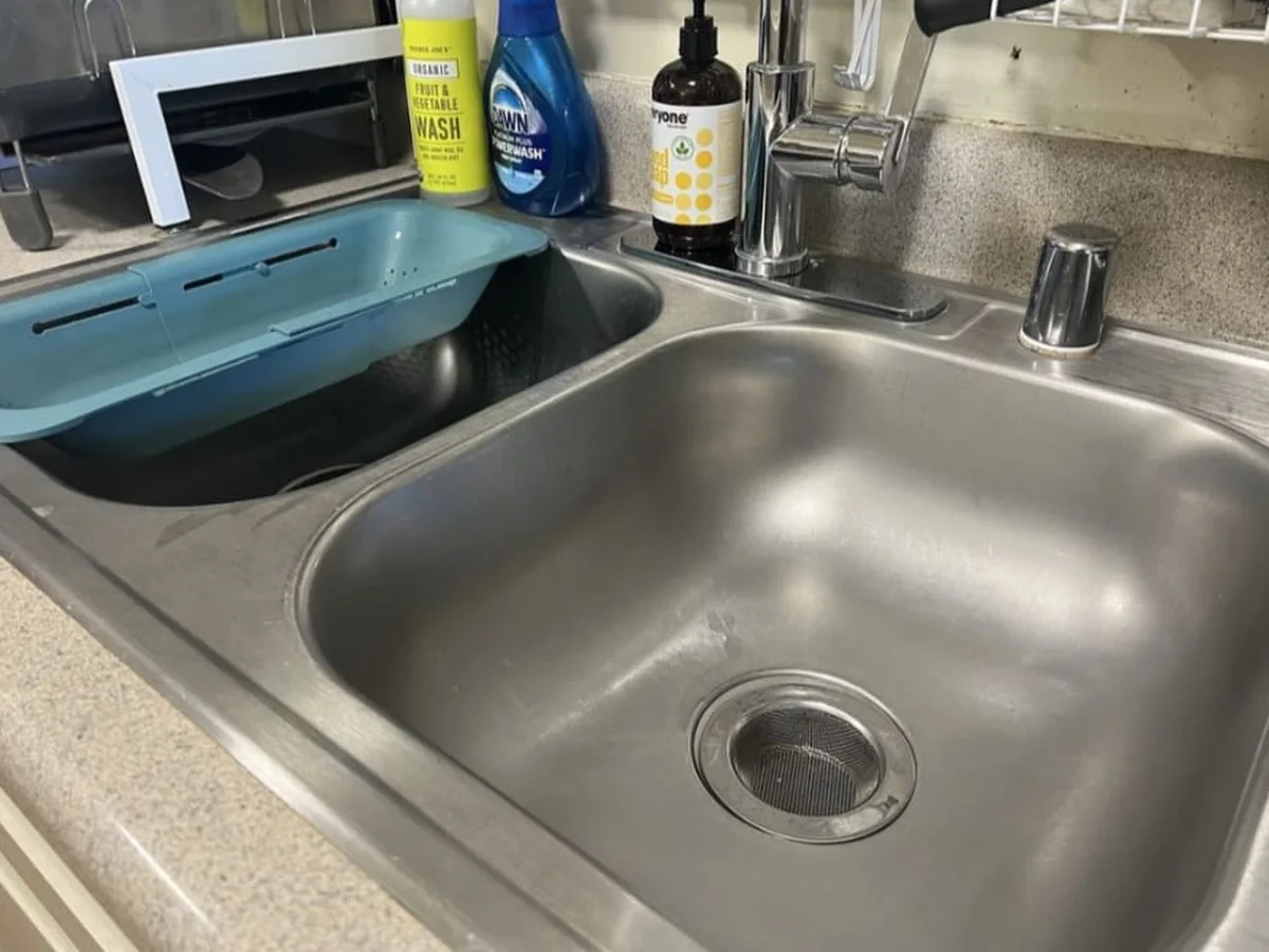 Stainless kitchen sink cleaned and scrubbed